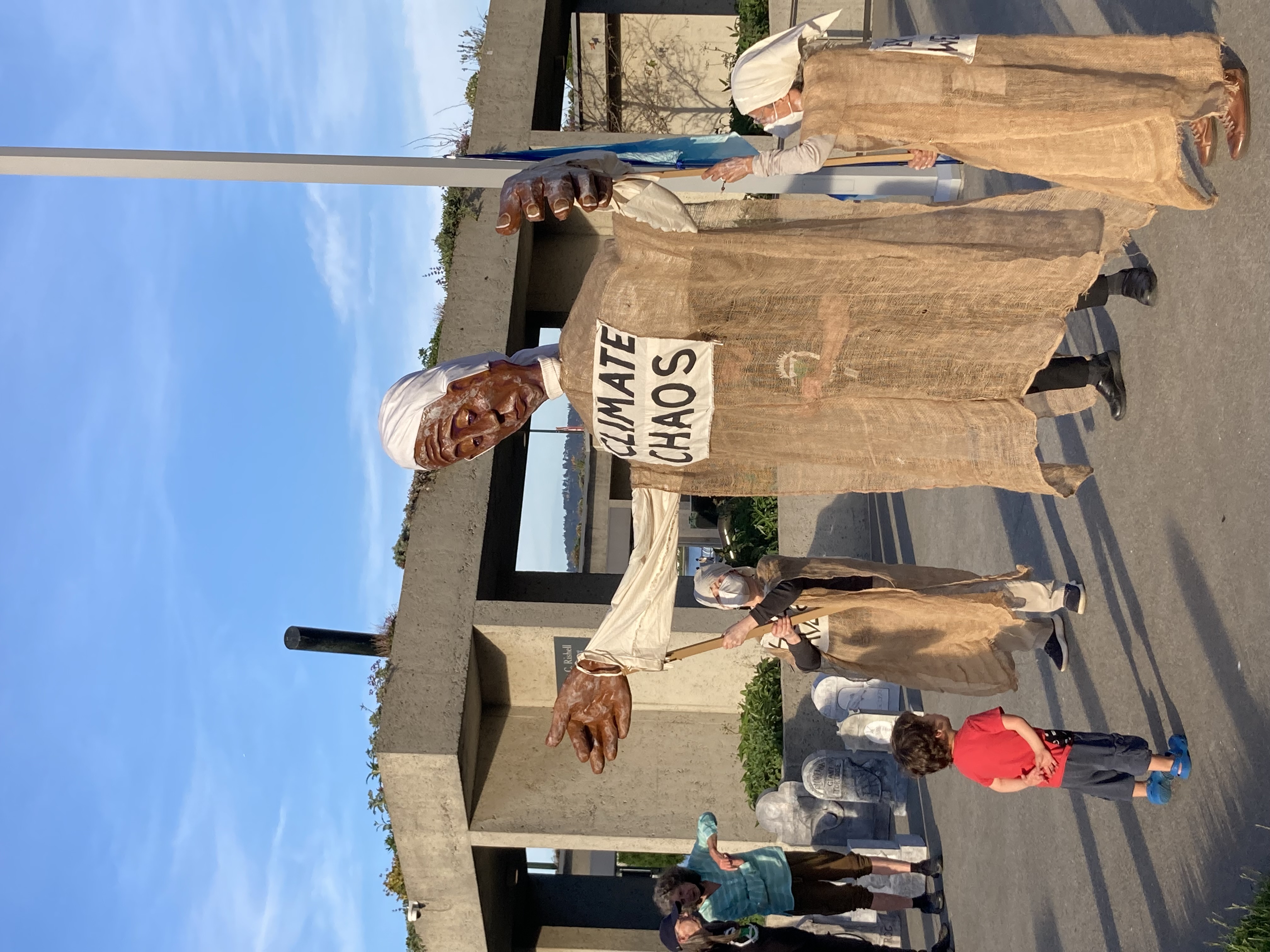 Dolores Large puppet dressed in burlap held by two Lamentors